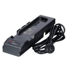 A 3M Versaflo Single Station Battery Charger Kit TR-642A beside power cord