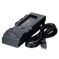 A 3M Versaflo Single Station Battery Charger Kit TR-342N beside power cord