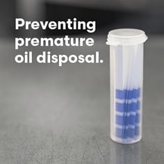 3M Oil Quality Monitoring Strips bottle standing on stainless steel table, text reads: Preventing premature oil disposal.