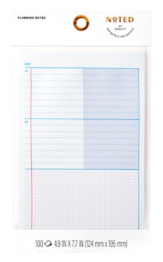 Product image of a white daily planning note with AM and PM sections and blue lines