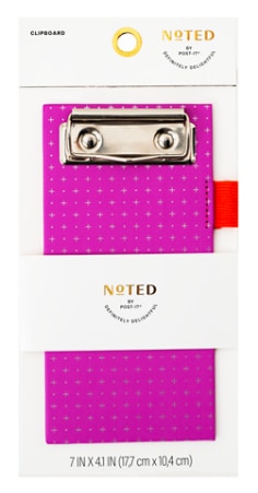 Product image of a hot pink mini clipboard with white dot grid pattern, silver clip and orange pen loop on the side