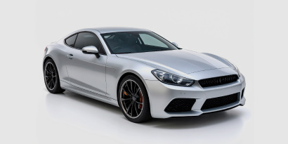 Rendering of a sleek grey coupe.