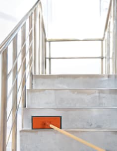 Scrubbing stairwell with blue pad