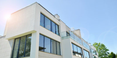 Modern home with a bright exterior and large windows.