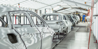 Line of vehicles in an automotive factory.