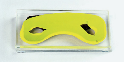 Customized die-cut section of structural adhesive tape.