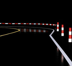 Buying zone Curved wet road in a work zone at night