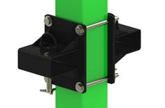 The image shows the fork‑pocket kit installed on a vertical, square Flexiguard post colored bright green. Two glossy black side plates sit on either side of the post and are tied together by two long, silver cross‑rods running horizontally through the plates, with hex nuts at the ends. The rods clamp the assembly snugly to the post. The overall appearance is a compact, heavy‑duty black steel mounting bracket securely wrapped around the green post. It provides sleeves for forklift tines so the Flexiguard M200 system can be semi‑fixed and moved or positioned for fall‑protection applications. The product is isolated against a clean white background, with no people or other objects present.