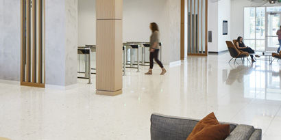 A bright, modern lobby space with clean, shiny floors.