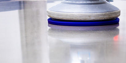 Close up on the floor pad of a portable auto scrubber.