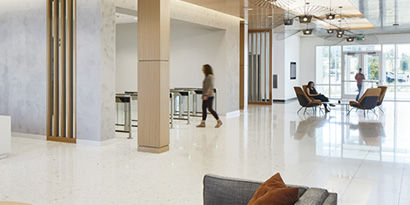 A bright, modern lobby space with clean, shiny floors.