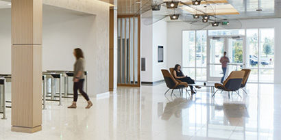 A bright, modern lobby space with clean, shiny floors.

