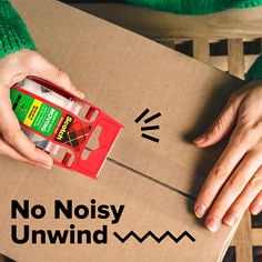 Scotch®, Heavy Duty, Quiet Unwind, Photo of a male sealing box with a heavy duty moving tape, while a female is using her laptop in the background.