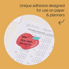 Image of a Post it® Apple shaped class note stuck to paper. Reader: Unique adhesive design for use on papers & planners