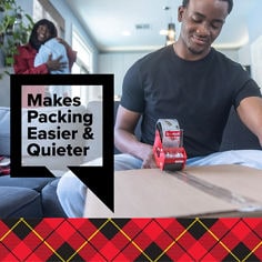 Image of a Man sealing a cardboard box with a Scotch Heavy Duty Moving Tape with dispenser and his partner holding a baby watching happy in the background. Reader: Makes packing Easier & Quieter.