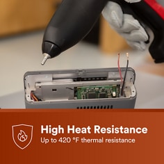 Hot melt adhesive is applied inside an electronic device assembly. The asset states High Heat Resistance, up to 420 Â°F thermal resistance.
