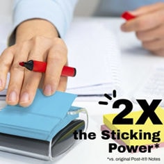Post-it® Neon Fizz B+ 3 Sticking Power image with the text “2X the Sticking Power*” and “*vs. original Post-it® Notes,” showing a hand pulling a blue sticky note from a clear dispenser with yellow and pink notes nearby.